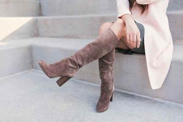 What are the Key Strategies for Wearing Over-the-Knee Boots Without Looking Over-the-Top?